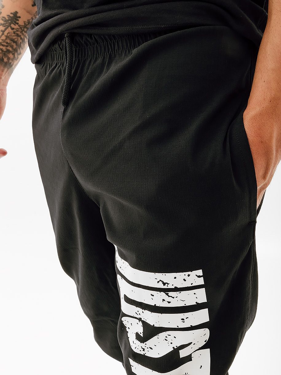 Штани Nike M NK DNA WOVEN PANT SSNL купити