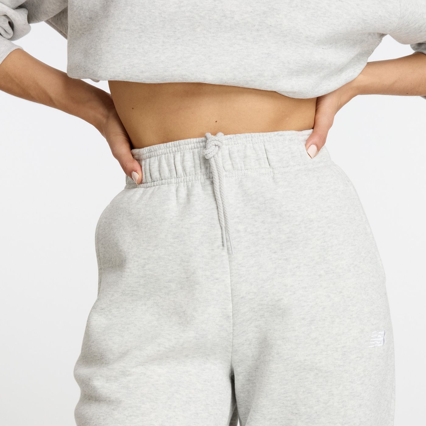 Штани спортивні New Balance ESSENTIALS FLEECE купити