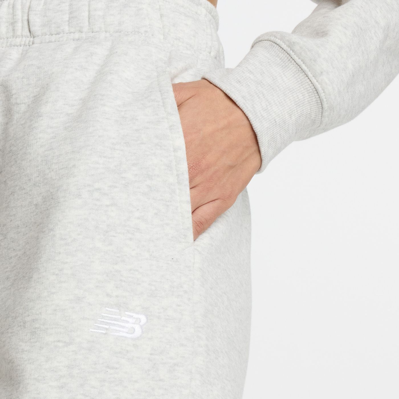 Штани спортивні New Balance ESSENTIALS FLEECE купити